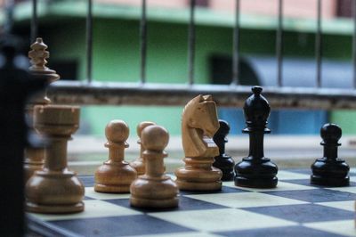 Close-up of chess pieces on table