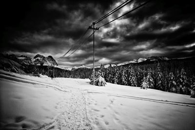 Scenic view of mountains against cloudy sky