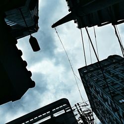 Low angle view of building against cloudy sky