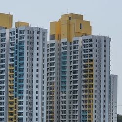 Low angle view of buildings against sky in city