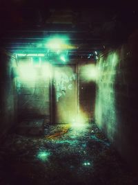 View of illuminated street lights in tunnel