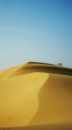 Scenic view of desert against clear sky