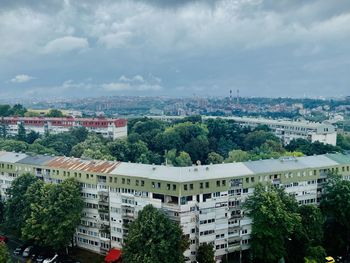 High angle view of buildings in city against sky