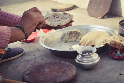Midsection of person preparing food