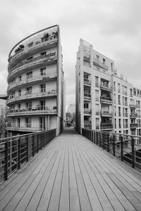 Street amidst buildings against sky