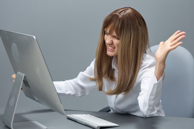 Young woman using laptop at home