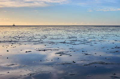 Scenic view of sea against sky during sunset