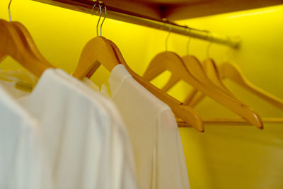 Close-up of clothes hanging on rack