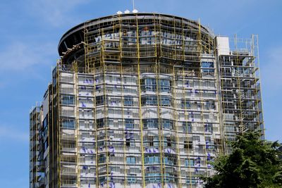 Low angle view of skyscrapers against sky