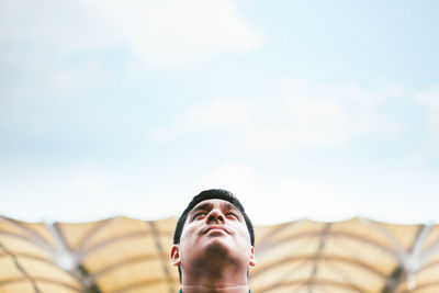 Low angle view of woman against the sky