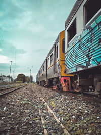 Train on railroad track against sky