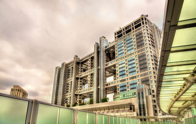 Low angle view of modern building against sky