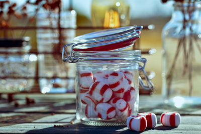 Jar of vintage style handmade red and white striped old fashioned mint candy