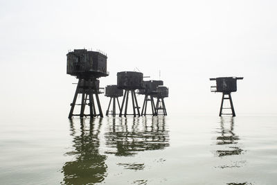 Lifeguard hut on sea against clear sky