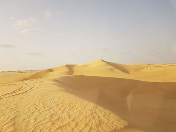 Scenic view of desert against sky