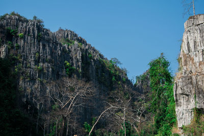 Low angle view of rocks against sky