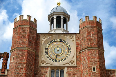 Low angle view of clock tower against sky in city