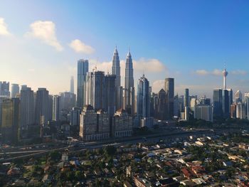 Modern buildings in city against sky