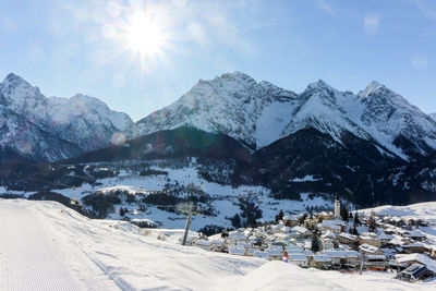 Scenic view of snow covered mountains against sky