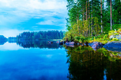 Reflection of clouds in calm lake