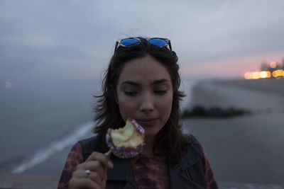 Young woman enjoying a candy apple