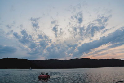 Scenic view of lake against sky during sunset