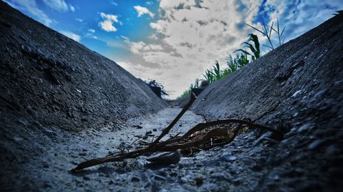 Low angle view of man on mountain against sky