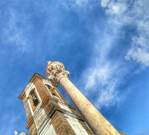 Low angle view of statue against blue sky