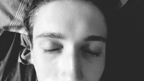 Cropped image of man sleeping at home