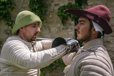 People fighting outdoors