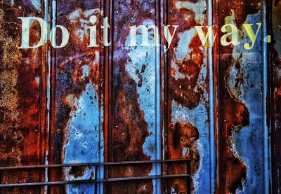 Full frame shot of rusting metal door