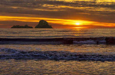 Scenic view of sea against sky during sunset