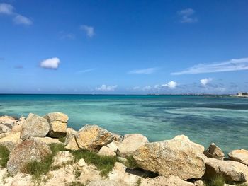 Scenic view of sea against blue sky