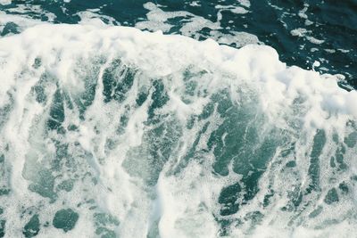 High angle view of waves splashing in sea