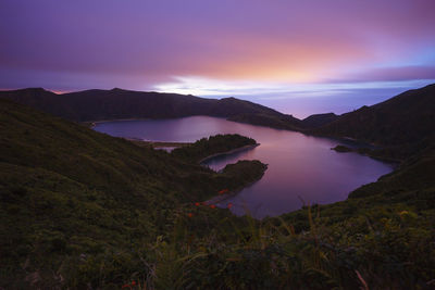 Scenic view of lake against sky during sunset