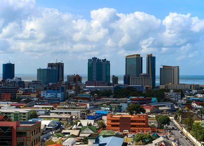 High angle view of buildings in city against sky