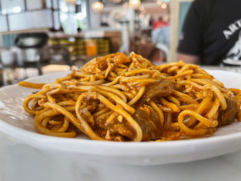 Close-up of noodles in plate on table