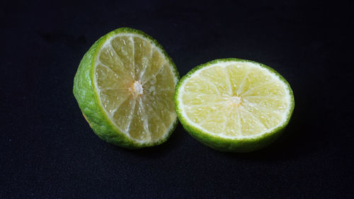 Close-up of lemon slice against black background