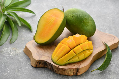 High angle view of chopped fruits on cutting board