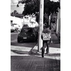 Woman walking on road