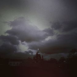 Low angle view of church against cloudy sky