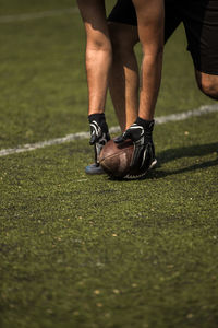 Low section of man playing flag football