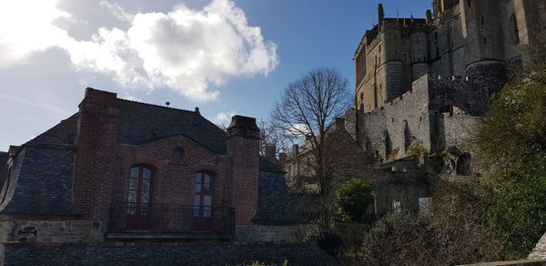 Low angle view of old building against sky