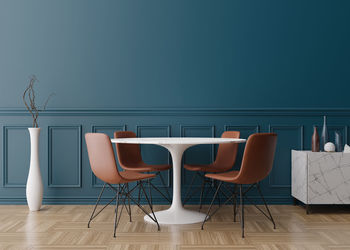 Empty blue wall in modern dining room. mock up interior in classic style. free space