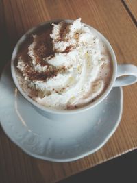 Close-up of cappuccino on table