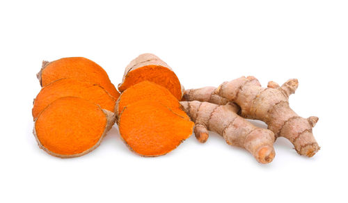 Close-up of turmeric against white background