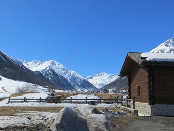 Snowcapped mountains and landscape against sky