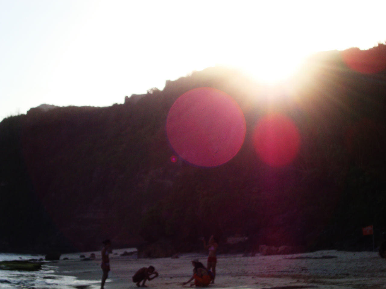 GROUP OF SILHOUETTE PEOPLE ON LAND AGAINST CLEAR SKY