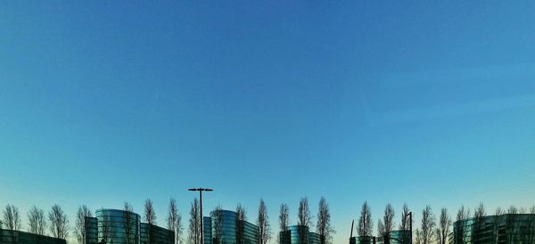 Low angle view of buildings against blue sky