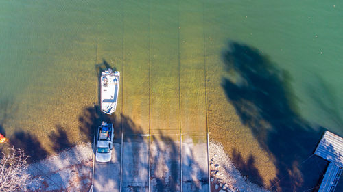 High angle view of information sign by sea